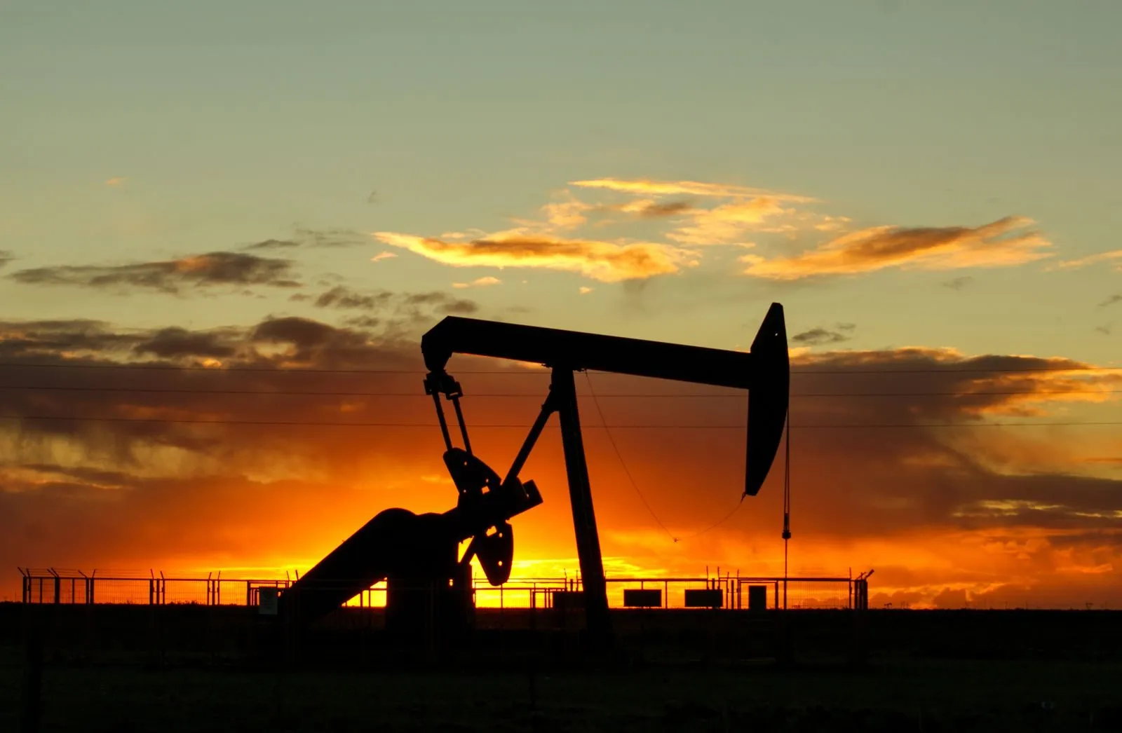 An oil pumpjack at sunset