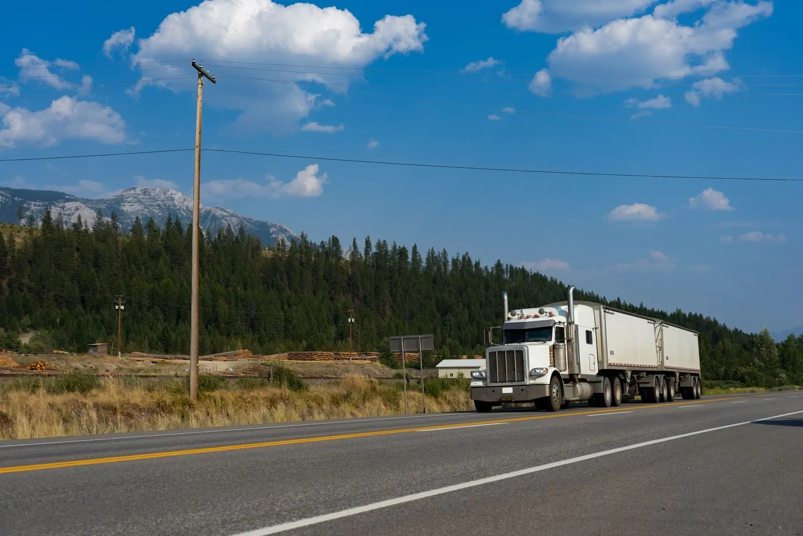 A transport truck on a highway in the BC mountains